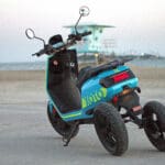 Blue XOTO back view at the beach